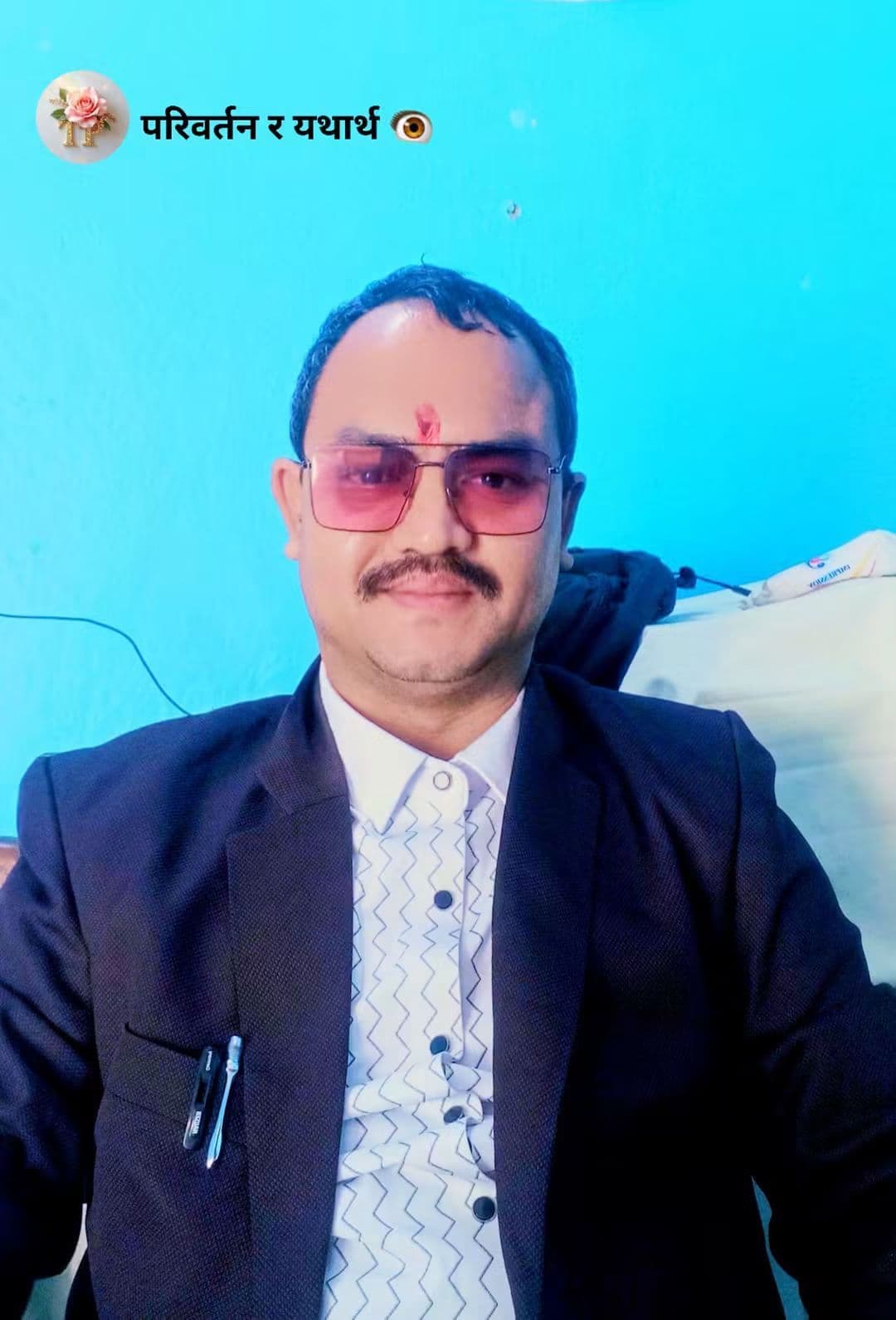 Portrait of Tej Prakash GC in a dark blazer